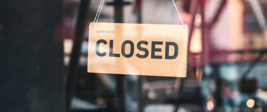 Sorry we're closed sign in shop window
